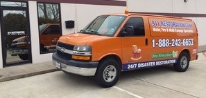 Water Damage and Mold Removal Restoration Van Ready At Commercial Job Site